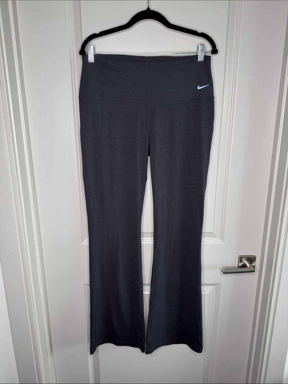 Nike Black Flared Performance Leggings with White Swoosh